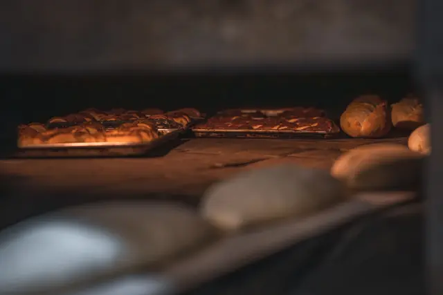 Freshly baked breads and pastries on a bakery counter