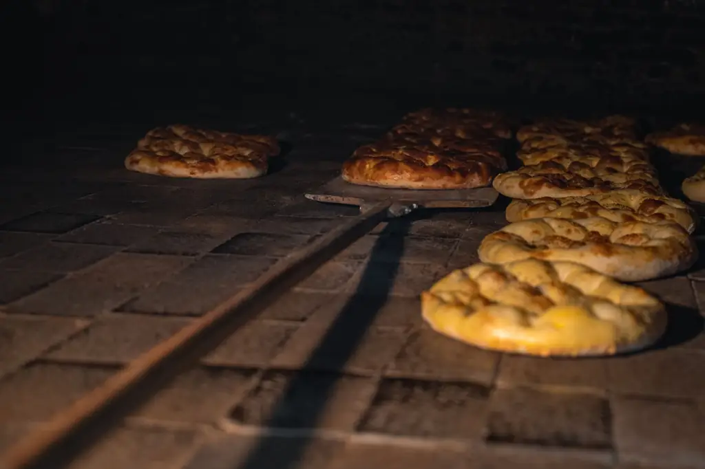 Golden loaves baking in a traditional stone oven